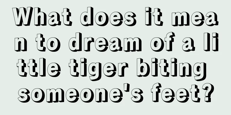 What does it mean to dream of a little tiger biting someone's feet?