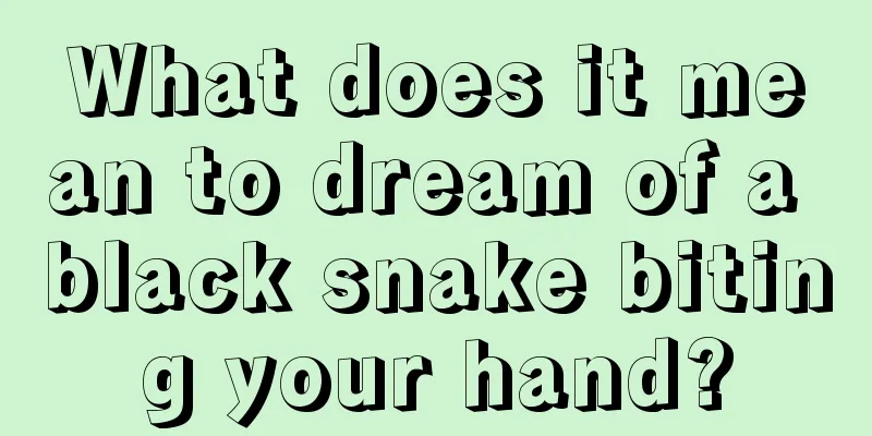 What does it mean to dream of a black snake biting your hand?