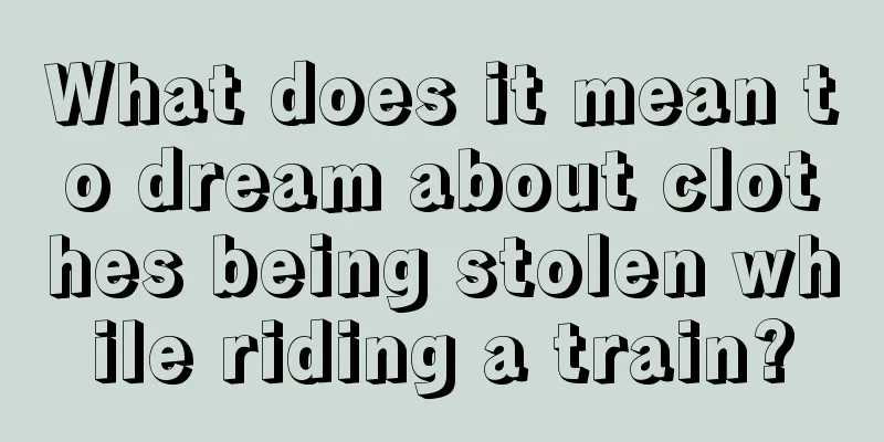 What does it mean to dream about clothes being stolen while riding a train?