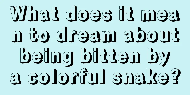 What does it mean to dream about being bitten by a colorful snake?