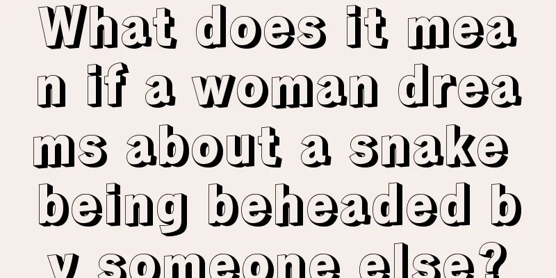 What does it mean if a woman dreams about a snake being beheaded by someone else?