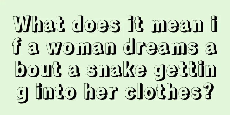 What does it mean if a woman dreams about a snake getting into her clothes?