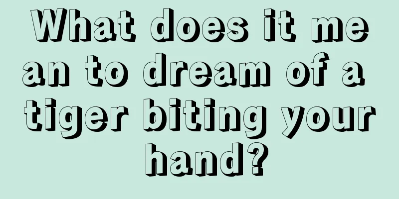 What does it mean to dream of a tiger biting your hand?